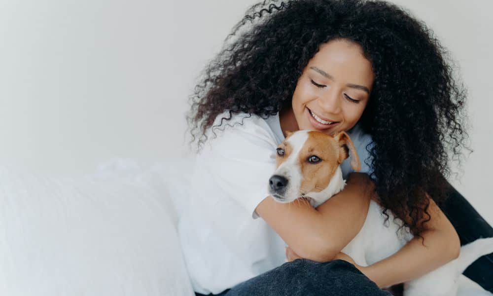 woman-hugging-dog-your-familys-trusted-pet-sitter